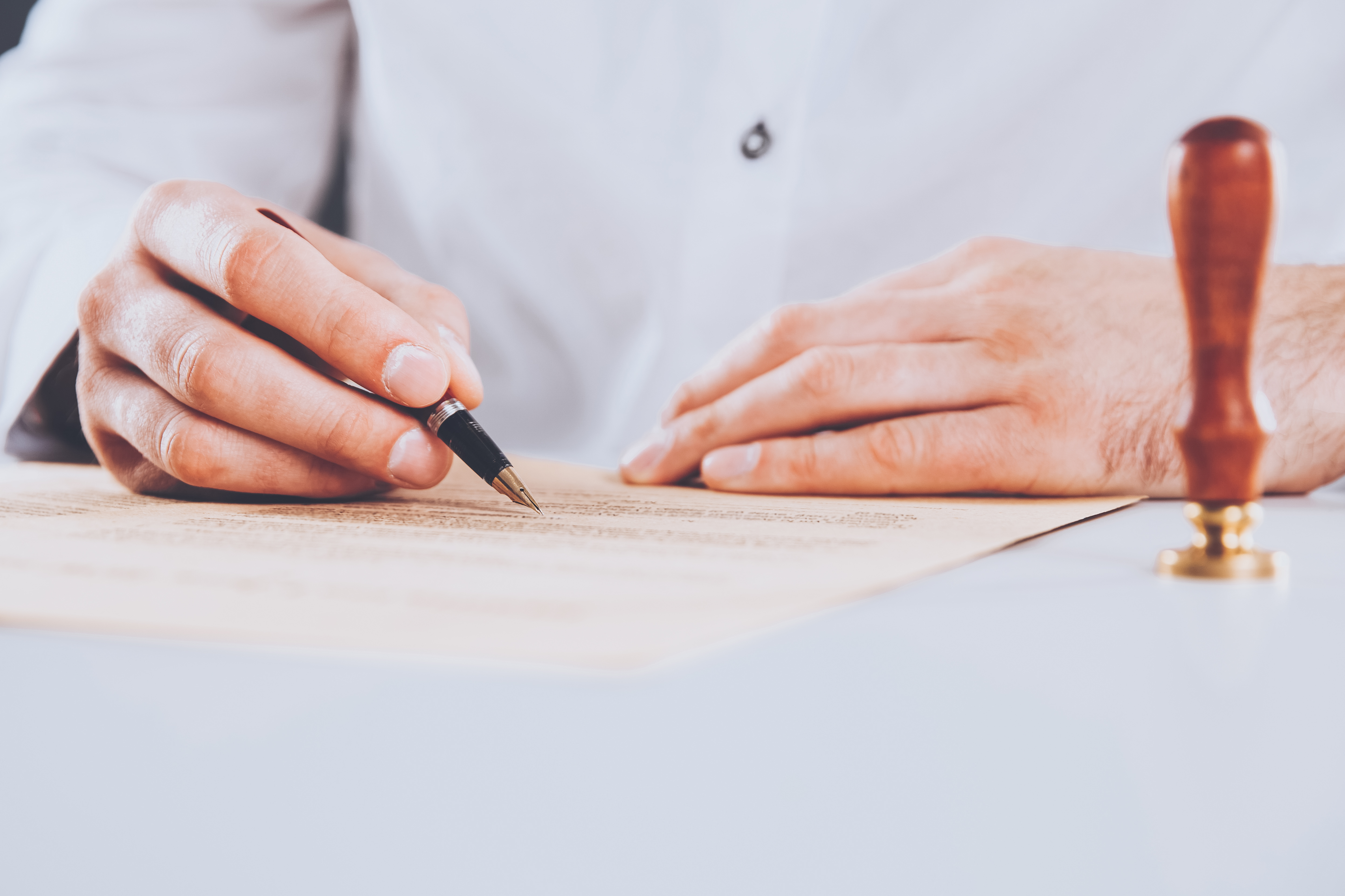 male-lawyer-working-with-contract-papers